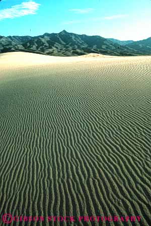 Stock Photo #7121: keywords -  accumulate accumulates accumulation barren blown california changeable changing countless deposit desert desiccated dried dry dune dunes dynamic earth environment geologic geological geology grain grains heat hot lifeless mojave movable moving nature particle particles pattern patterns physical pile ripple ripples sand sanddune sanddunes science sediment sedimentary sedimentation vert wind