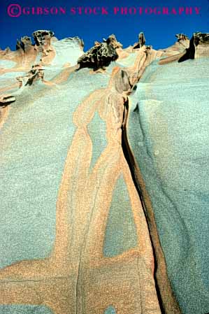 Stock Photo #7153: keywords - abstract abstraction california earth environment erode erodes eroding erosion form fort geologic geological geology hard harden hardened layer layers nature physical pink red rock ross sandstone science seafloor sediment sedimentary sediments strata stratum vert