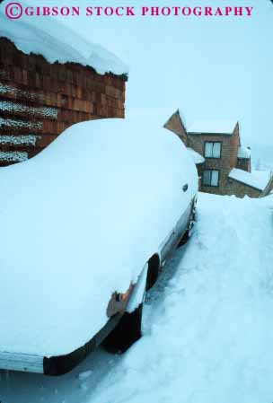 Stock Photo #7243: keywords -  auto automobile autos buried bury car cars climate climatology cold freeze freezing frozen ice icy inconvenience inconvenient nature outdoor outside park parked parking pile precipitation residence residential season snow under vehicle vert weather winter