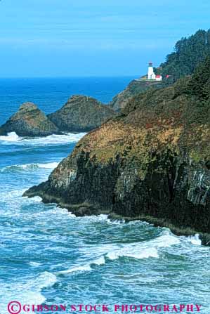 Stock Photo #7258: keywords - assist assistance bluff building cliff coastal continent edge elevate head heceta help helping helps house land landscape light lighthouse marine maritime nature navigate navigating navigation ocean oregon point promontory safe safety scenery scenic sea seascape seashore shore shoreline steep surf vert warn warning wave waves
