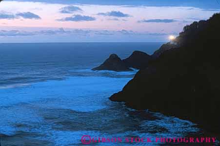 Stock Photo #7259: keywords -  assist assistance bluff building cliff coast coastal continent dusk edge elevate head heceta help helping helps horz house land landscape light lighthouse marine maritime nature navigate navigating navigation ocean oregon point promontory safe safety scenery scenic sea seascape seashore shore shoreline steep surf warn warning wave waves