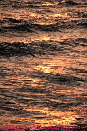 Stock Photo #7275: keywords -  abstract abstractions abstracts dawn dusk glisten glistening glistens landscape mood moody nature ocean pattern reflect reflecting reflection reflects ripples scenery scenic sun sunrise sunset texture vert warm wave waves