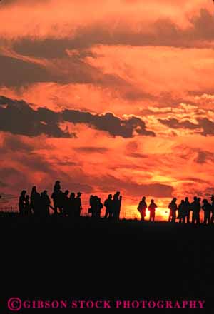 Stock Photo #7324: keywords - abstract abstraction abstracts cluster dawn dusk gather gathering group hill line mood moody nature orange people row silhouette silhouettes social sun sunrise sunset top vert warm