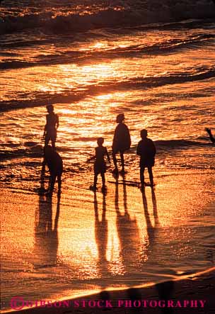 Stock Photo #7326: keywords -  beach california child children coast coastal dawn dusk friend friends group in kid kids monica mood moody nature ocean people play playing recreation santa sea shore shoreline silhouette silhouettes social sun sunrise sunset surf swim together vert walk walking warm water