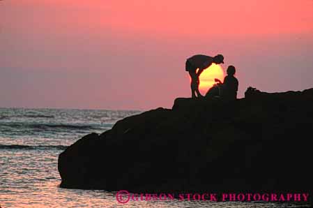 Stock Photo #7328: keywords - affection caring couple dawn dusk evening horz intimacy intimate love lover lovers loving man mood moody morning nature near ocean people picnic privacy private romantic share silhouette silhouettes social sun sunrise sunset together warm woman