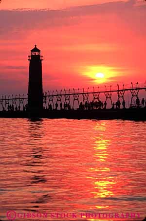 Stock Photo #7336: keywords -  building buildings dusk evening grand haven house lake light lighthouse manmade michigan mood moody orange red resort silhouette silhouettes structure summer sun sunrise sunset tower travel vacation vert warm water