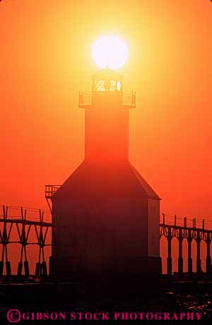 Stock Photo #7337: keywords -  building buildings dusk evening house joseph lake light lighthouse manmade michigan mood moody orange resort saint silhouette silhouettes st structure summer sun sunrise sunset tower travel vacation vert warm water yellow