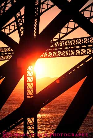 Stock Photo #7342: keywords -  brace braces bridge building buildings california dawn design dusk engineer engineering evening francisco gate geometric geometrical geometry golden grid iron manmade metal mood moody morning san silhouette silhouettes steel structure sun sunrise sunset supports triangle triangles vert warm