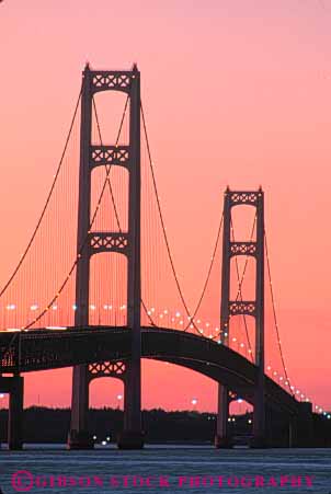 Stock Photo #7344: keywords -  across bridge bridges building buildings connect connecting connection cross crossing dawn dusk evening lake landscape mackinac manmade michigan mood moody morning over pair pink scenery scenic silhouette silhouettes span spanning structure sun sunrise sunset suspension tall tower towers transportation vert warm water