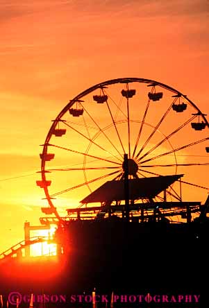 Stock Photo #7345: keywords - amusement building buildings california circumference dawn dusk evening fair ferris festival landscape manmade monica mood moody morning park pier play radius resort ride rotate rotates rotating rotation round santa scenery scenic silhouette silhouettes structure sun sunrise sunset travel vacation vert warm wheel