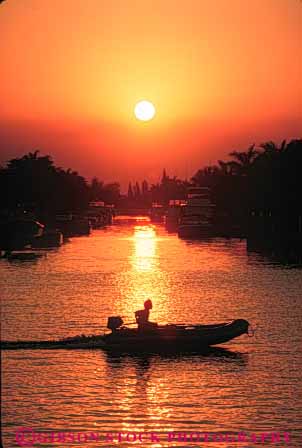 Stock Photo #7349: keywords -  beach boat boater boating boats coast coastal dawn dusk evening florida inflatable manmade marine maritime mood moody ocean outboard pompano sea shore shoreline silhouette silhouettes structure sun sunrise sunset vert warm water yacht