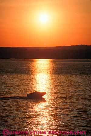 Stock Photo #7350: keywords - arizona boat boater boating boats coast coastal dawn dusk evening havasu lake manmade marine maritime mood moody motorboat ocean outboard reflect reflection reflects resort sea shore shoreline silhouette silhouettes structure sun sunrise sunset vert warm water yacht