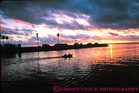 Stock Photo #7355: keywords -  boat boater boating boats california coast coastal dawn dusk evening harbor horz manmade marina marinas marine maritime mood moody motorboat ocean oceanside outboard sea shore shoreline silhouette silhouettes structure sun sunrise sunset warm water yacht