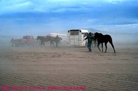 Stock Photo #7461: keywords - air airborne breath breathing cloud clouds cowboys dust eye hazard hazardous health horses horz irritant irritate occupational particle particles pollute polluted polluting pollution vision