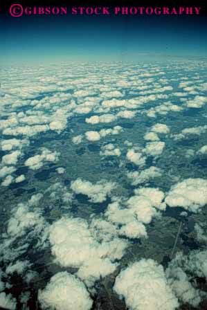 Stock Photo #6981: keywords -  above aerial atmosphere atmospheric climate cloud clouds condensate condensation condense condensed condensing cool cooling cumulus elevate elevated environment float floating floats fog moisture nature over pattern sky skyward suspend suspended texture vapor vert view water weather