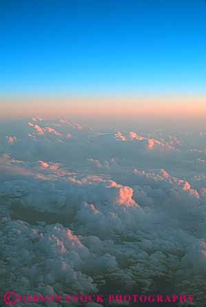 Stock Photo #6982: keywords - above aerial atmosphere atmospheric climate cloud clouds condensate condensation condense condensed condensing cool cooling cumulus dusk elevate elevated environment float floating floats fog moisture nature over pattern sky skyward suspend suspended texture vapor vert view water weather