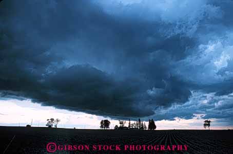 Stock Photo #6990: keywords -  agriculture atmosphere atmospheric building buildings climate cloud clouds condensate condensation condense condensed condensing cool cooling countryside dark environment farm farming farms field float floating floats fog horz iowa moisture mood moody nature rural sky skyward storm storms stormy suspend suspended thunder thundercloud tree trees vapor water weather