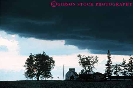 Stock Photo #6994: keywords -  agriculture atmosphere atmospheric building buildings climate cloud clouds condensate condensation condense condensed condensing cool cooling countryside dark environment farm farming farms field float floating floats fog horz iowa moisture mood moody nature rural sky skyward storm storms stormy suspend suspended thunder thundercloud tree trees vapor water weather