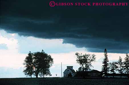 Stock Photo #6994: keywords - agriculture atmosphere atmospheric building buildings climate cloud clouds condensate condensation condense condensed condensing cool cooling countryside dark environment farm farming farms field float floating floats fog horz iowa moisture mood moody nature rural sky skyward storm storms stormy suspend suspended thunder thundercloud tree trees vapor water weather