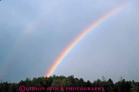 Stock Photo #7028: keywords -  atmosphere atmospheric climate cloud condensate condensation condense condensed condensing cool cooling countryside dark diffract diffracting diffraction distort distortion environment field float floating floats fog gravity horz light moisture mood moody nature prism rain rainbow rainy rural sky skyward spectrum storm storms stormy suspend suspended tree trees vapor water weather wet