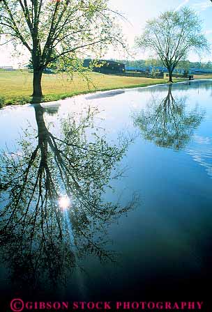 Stock Photo #13858: keywords -  alabama calm cullman flat in landscape mirror mirrorlike mirrors nature peaceful pond ponds quiet reflect reflecting reflection reflects scenery scenic serene silhouette south southern still tree trees vert water wilderness