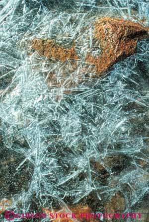 Stock Photo #7060: keywords -  chill chilly cold crack cracked crystal crystals environment freeze freezing frozen ice icy nature puddle season snow surface vert water wet winter