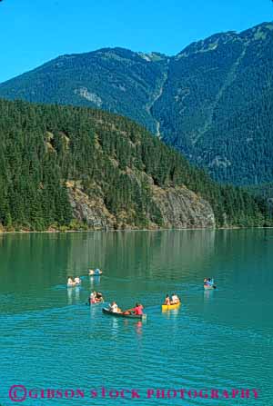 Stock Photo #5521: keywords -  adventure boat boaters boating calm canoe canoeing cascades exercise expedition explore exploring float floating flotation group lake landscape national north outdoor outdoors outside paddle paddlers paddling park peaceful quiet recreation reflection scene scenic serene share sport summer team teen teenage teenagers together trek vacation vert washington water wilderness