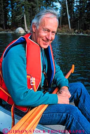 Stock Photo #5522: keywords -  adventure boat boaters boating calm canoe canoeing exercise expedition explore exploring float floating flotation group happy jacket lake landscape life male man outdoor outdoors outside paddle paddlers paddling peaceful portrait quiet recreation reflection released scene scenic senior serene smile sport summer team trek vacation vert vest water wilderness