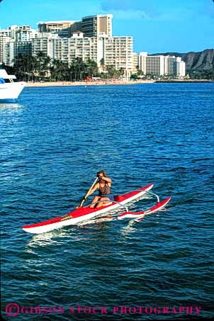 Stock Photo #5525: keywords -  adventure along balance beach boat boaters boating calm canoe canoeing coast exercise explore exploring female float floating flotation hawaii island ocean outdoor outdoors outrigger outside paddle paddlers paddles paddling peaceful quiet recreation scene scenic sea serene solitary solitude sport summer trek vacation vert waikiki water woman