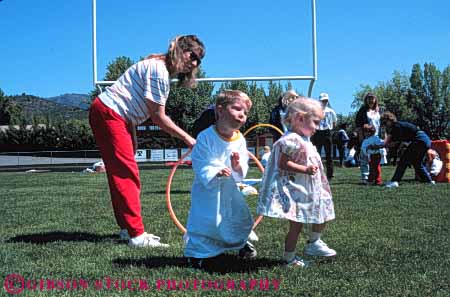 Stock Photo #5532: keywords -  activity agile agility and athlete athletic boy child children compete competing competition competitor contest disability disabled disadvantage disadvantaged educate educating education elementary event field game girl group handicap handicapped horz mother need needs olympic olympics recreation retarded school special sport student students team track youth