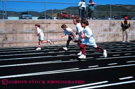 Stock Photo #5533: keywords -  action activity and athlete athletic blur child children compete competing competition competitor contest disability disabled disadvantage disadvantaged educate educating education elementary event field foot girls group handicap handicapped horz motion move movement moving need needs olympic olympics race ran recreation retarded run runner runners running school special sport student students team track youth