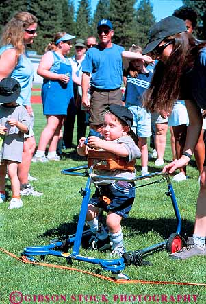 Stock Photo #12308: keywords - annual bag bean boy california challenge challenged child children disabilities disability disable event frame fun handicap handicapped mainstream mainstreaming need needs olympics play playing recreation retard retarded roll rolling rolls special sport sports throw vert walker walkers weed with