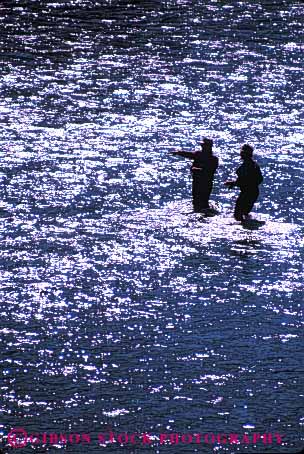 Stock Photo #5535: keywords -  catch creek fish fisherman fishermen fishing glare men outdoor outdoors outside recreation reflection ripple ripples river share silhouette sport stream team together two vacation vert water