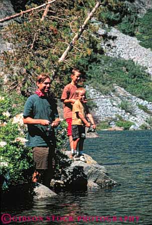 Stock Photo #5536: keywords -  boy boys brother brothers catch child children family father fish fisherman fishermen fishing happy lake man outdoor outdoors outside parent portrait recreation released share sibling single sons sport stand standing summer three together vacation vert water