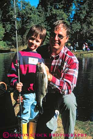 Stock Photo #5537: keywords -  boast boasting boasts boy catch caught dad father fish fisherman fishermen fishing man outdoor outdoors outside pride proud recreation released son sport team trout vert water