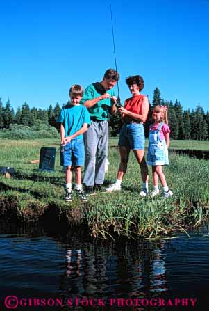 Stock Photo #5544: keywords -  assist boy brother catch colorful cooperate family fish fisherman fishermen fishing four girl help husband man outdoor outdoors outside recreation released share sibling sister sport stream summer team together vacation vert water wife woman