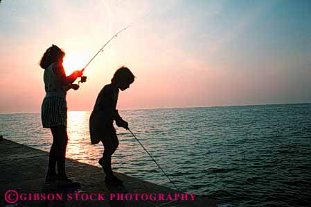 Stock Photo #5548: keywords -  boy brother catch children evening fish fisherman fishermen fishing girl horz ocean outdoor outdoors outside recreation sibling silhouette sister sport summer water youth youths