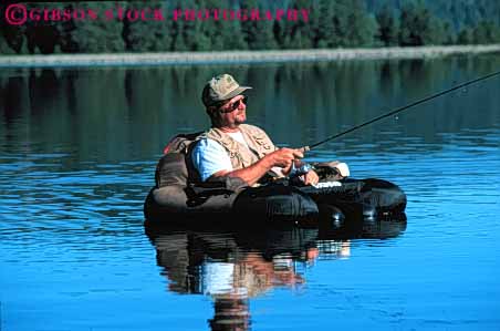 Stock Photo #5550: keywords -  alone calm catch fish fisherman fishermen fishing float floating horz lake man outdoor outdoors outside peaceful private quiet recreation released serene solitude sport summer water