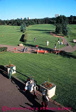 Stock Photo #5563: keywords -  canada club country course edmonton golf golfer golfers golfing grass green lawn outdoor outdoors outside practice recreation skill sport summer tee vert victoria