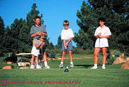 Stock Photo #5564: keywords -  brother club country course daughter family father four golf golfer golfers golfing grass green horz husband lawn learn mother outdoor outdoors outside parent parents practice recreation released share sibling sister skill son sport spouse summer together wife