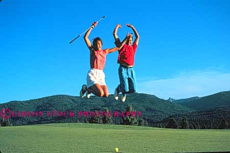 Stock Photo #5568: keywords -  club country couple course express expression golf golfer golfers golfing grass green horz joy jump lawn leap outdoor outdoors outside practice recreation released share skill sport summer thrill together