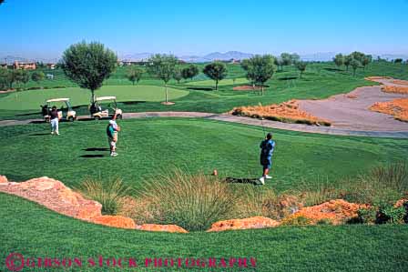 Stock Photo #5569: keywords -  club country course golf golfer golfers golfing grass green horz las lawn nv off outdoor outdoors outside practice recreation resort skill sport summer summerlin tee vegas