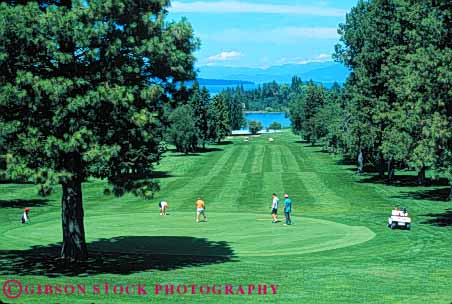 Stock Photo #5573: keywords - club country course flathead golf golfer golfers golfing grass green horz lake lawn montana mt outdoor outdoors outside practice recreation skill sport summer
