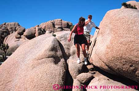 Stock Photo #5588: keywords - affection assist assistance california care couple desert exercise explore fit fitness help hike hikers hiking horz joshua man move national outdoor outdoors outside park physical physically released rocks share summer sunny together tree walk walker walking woman workout