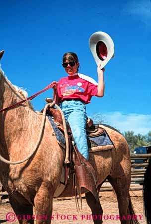 Stock Photo #5598: keywords -  animal girl horse horseback horses hot large mammal outdoor outdoors outside recreation released ride rider riding sport teen teenage teenager teenagers trained vert wave west western woman young