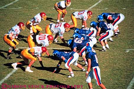 Stock Photo #3540: keywords -  college collision competition competitive face fall football game horz junior men off outdoor sport sports team uniform violent