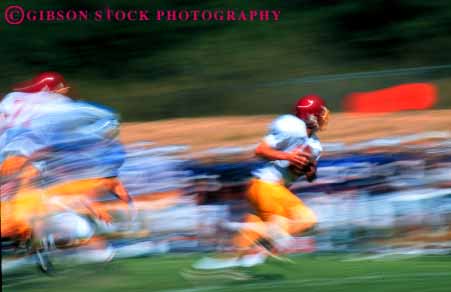 Stock Photo #5644: keywords -  action ball blur college compete competing competition competitive competitor contact coordinate coordination defense defensive dynamic fast field fit fitness football game horz injury loose looser man men motion move movement moving offense offensive pass physical plan practice quarterback rule rules run score speed sport tackle team throw uniform uniforms unity violent win winner