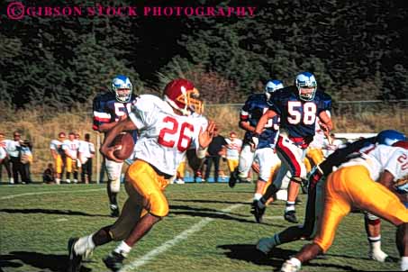 Stock Photo #5649: keywords - action african american back ball college compete competing competition competitive competitor contact coordinate coordination defense defensive ethnic field fit fitness football game horz injury loose looser man men minority motion move movement moving offense ofrfensive oppose opposition pass physical plan practice quarterback rule rules run score sport sports tackle team throw uniform uniforms unity violent win winner