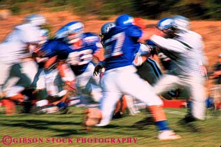 Stock Photo #5650: keywords - action ball blur college compete competing competition competitive competitor contact coordinate coordination defense defensive dynamic fast field fit fitness football game horz injury loose looser man men motion move movement moving offense offensive oppose opposition pass physical plan practice rule rules run score speed sport sports tackle team throw uniform uniforms unity violent win winner