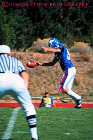 Stock Photo #5652: keywords - action ball college compete competing competition competitive competitor contact coordinate coordination defense defensive field fit fitness football game injury kick kicker loose looser man men move movement offense offensive oppose opposition pass physical plan practice punt rule rules run score sport sports tackle team throw uniform uniforms unity vert violent win winner